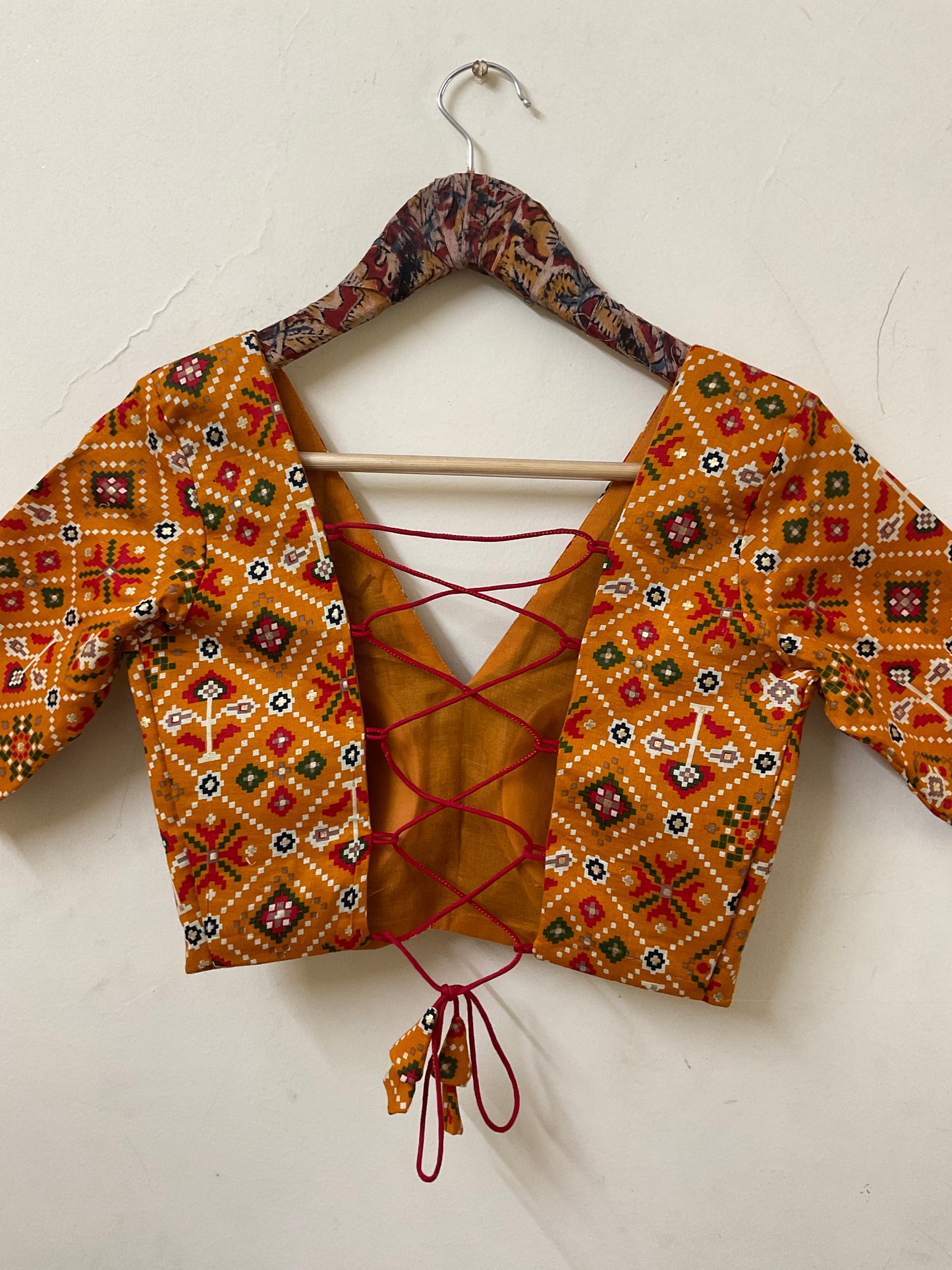 NAVELI – Mustard Yellow Patola Print Backless Blouse