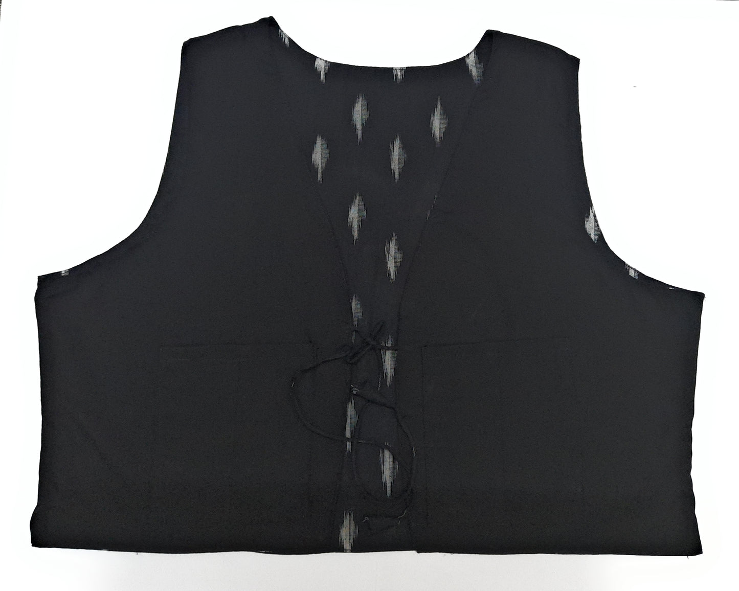 Black sleeveless garment with button details on a white background