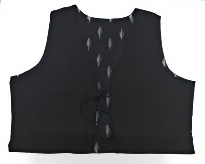 Black sleeveless garment with button details on a white background