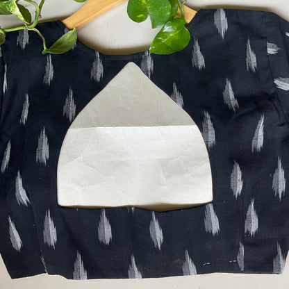 Black blouse with white abstract pattern on a white background