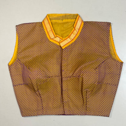 Vest with a geometric pattern and yellow coller on a light grey background