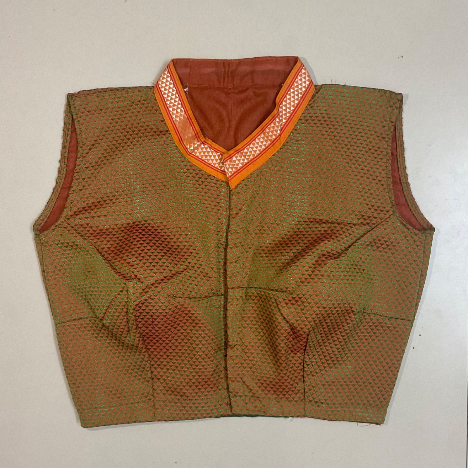 Green  vest with orange trim on a white background