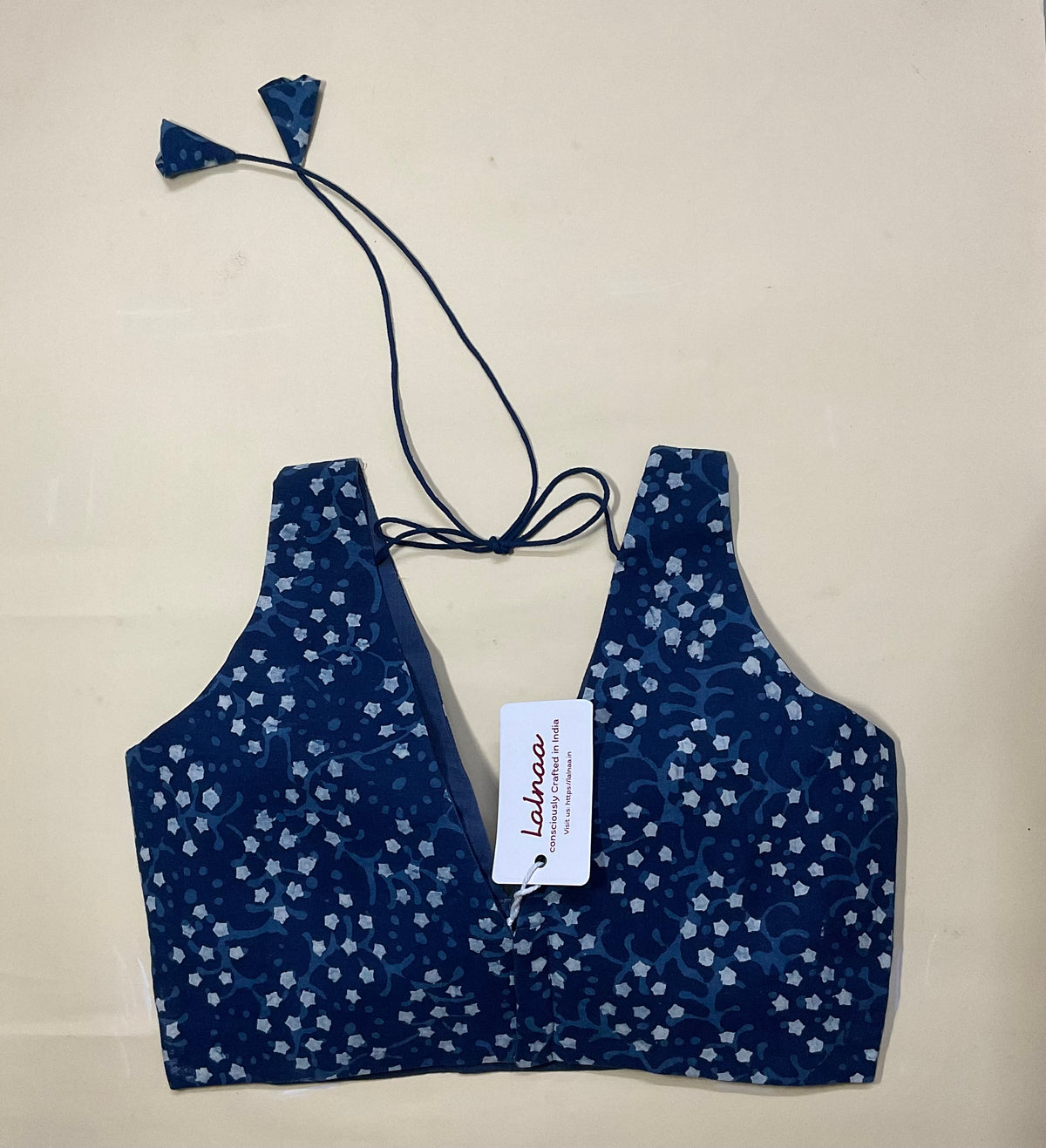 Indigo sleeveless deep-v neck blouse with contrast